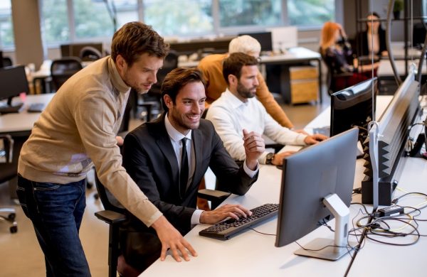 Senior businesswoman and young business people work in the modern office